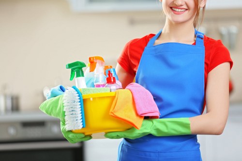 Professional office cleaners maintaining a clean workspace in SW12