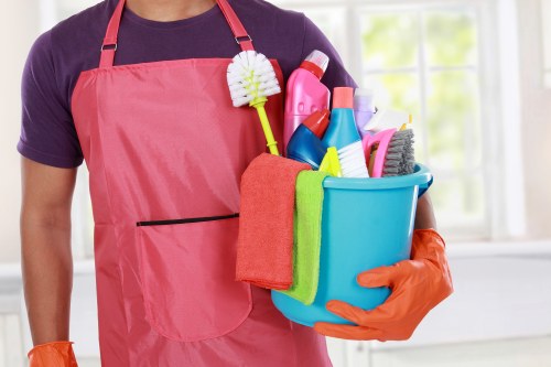 Professional sofa cleaning in SW12 removing dust and stains from a fabric sofa