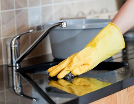 Professional oven cleaner in SW12 deep cleaning a built-in oven