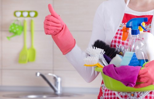 Deep cleaning a modern sofa with specialist equipment in SW12
