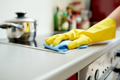 Cleaner treating a carpet stain with specialist equipment